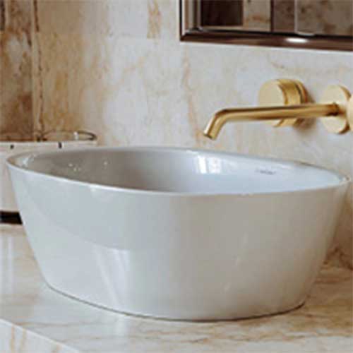 porcelain bathroom sink with gold faucet